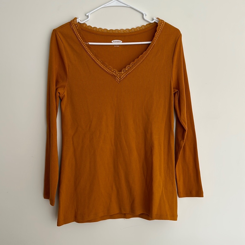 Like new, long-sleeved, gold shirt.